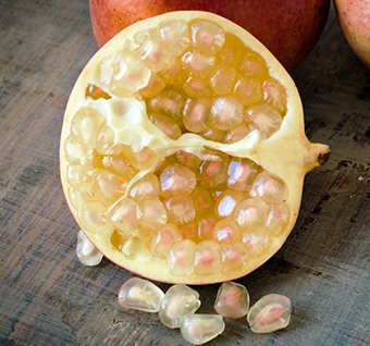 ripe pomegranate half with white seeds